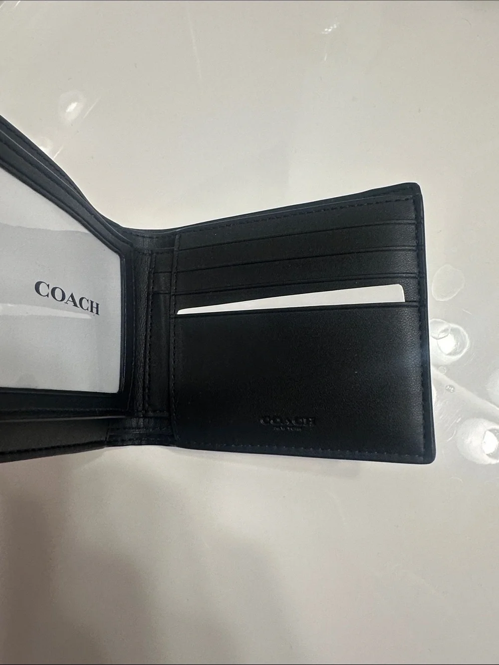 Coach Men's Black Signature Pattern Bifold Wallet with Blue and Cream Stripes
